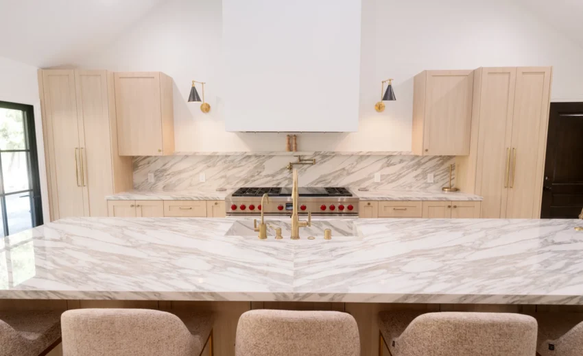 Kitchen with shaker cabinetry, stone island and range wall, Bel Air Project by Home Deco