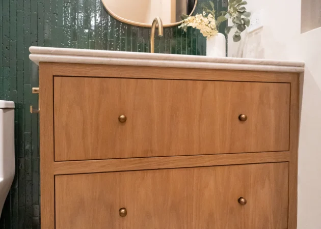 Wood vanity on legs with green tile wall, Dickens Project by Home Deco