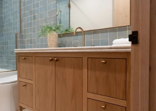 Wood vanity with blue tile backsplash, Dickens Project by Home Deco