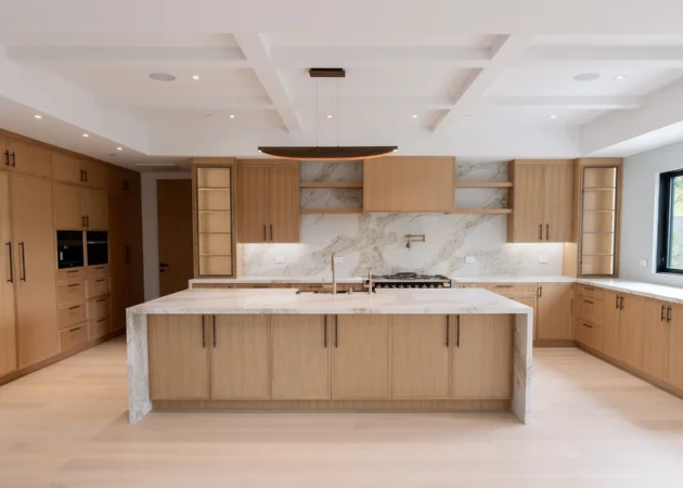 Kitchen with waterfall island and wood cabinetry, Lynngrove Project by Home Deco