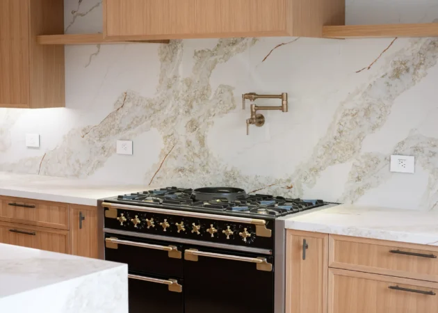 Range wall with wood hood and floating shelves, Lynngrove Project by Home Deco