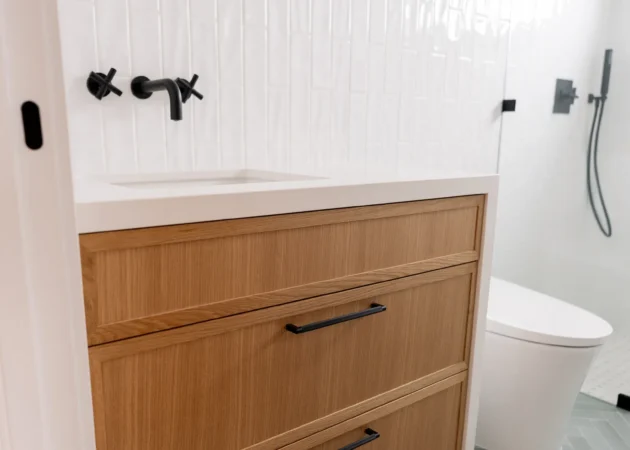 Wood bathroom vanity with black fixtures, Lynngrove Project by Home Deco