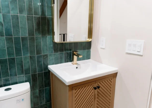 Fluted wood vanity with green tile, Wilson Project by Home Deco